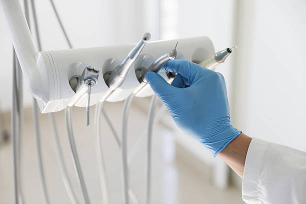 Professional Tooth Extraction technician working in Covington, LA